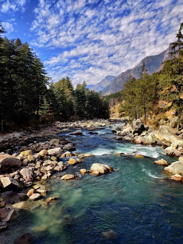 Parvati river amidst forest in Kasol, must-visit scenery